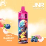 Vape jetable JNR Alien Peach Blueberry Candy avec design extraterrestre vibrant, saveur pêche, myrtille et bonbon, capacité de 10000 Puffs et batterie de 850mAh.