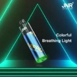 JNR BAR PRO disposable vape in Summer Peach Ice flavor, featuring a sleek blue and gold design with a vibrant green breathing light at the base.
